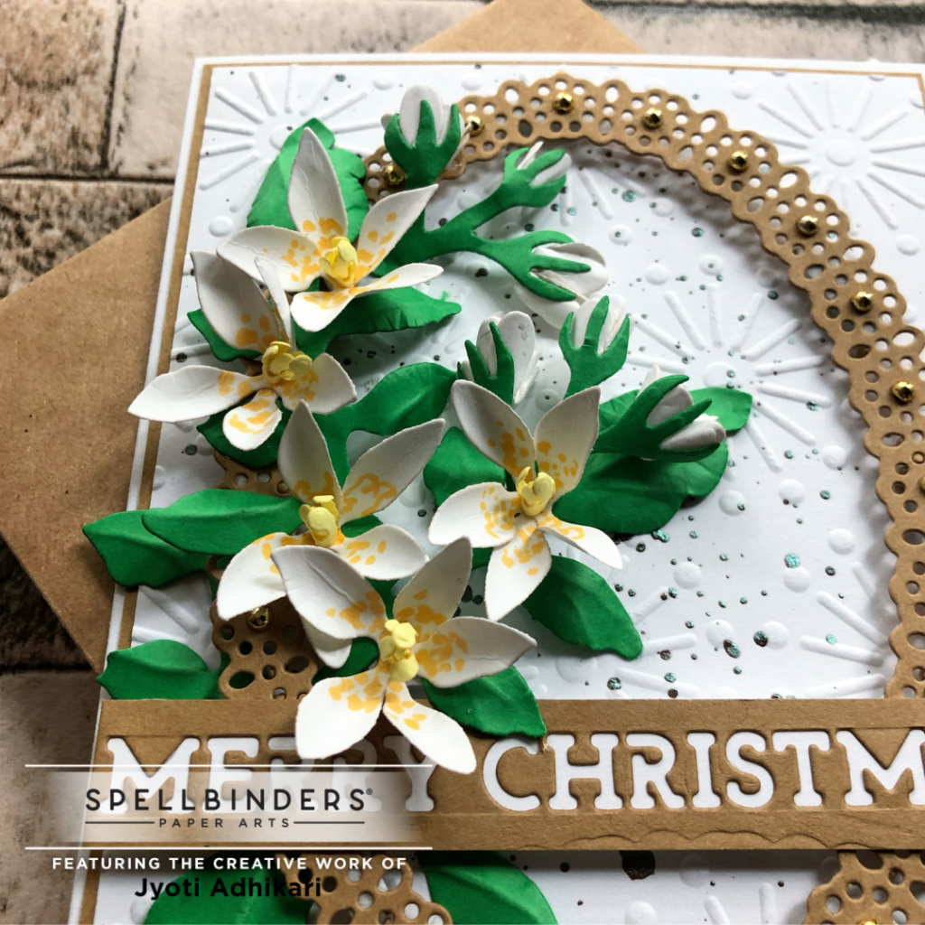 closeup view of the jasmine merry christmas card I created with the jasmine die from the winter garden collection by spellbinders July2022
