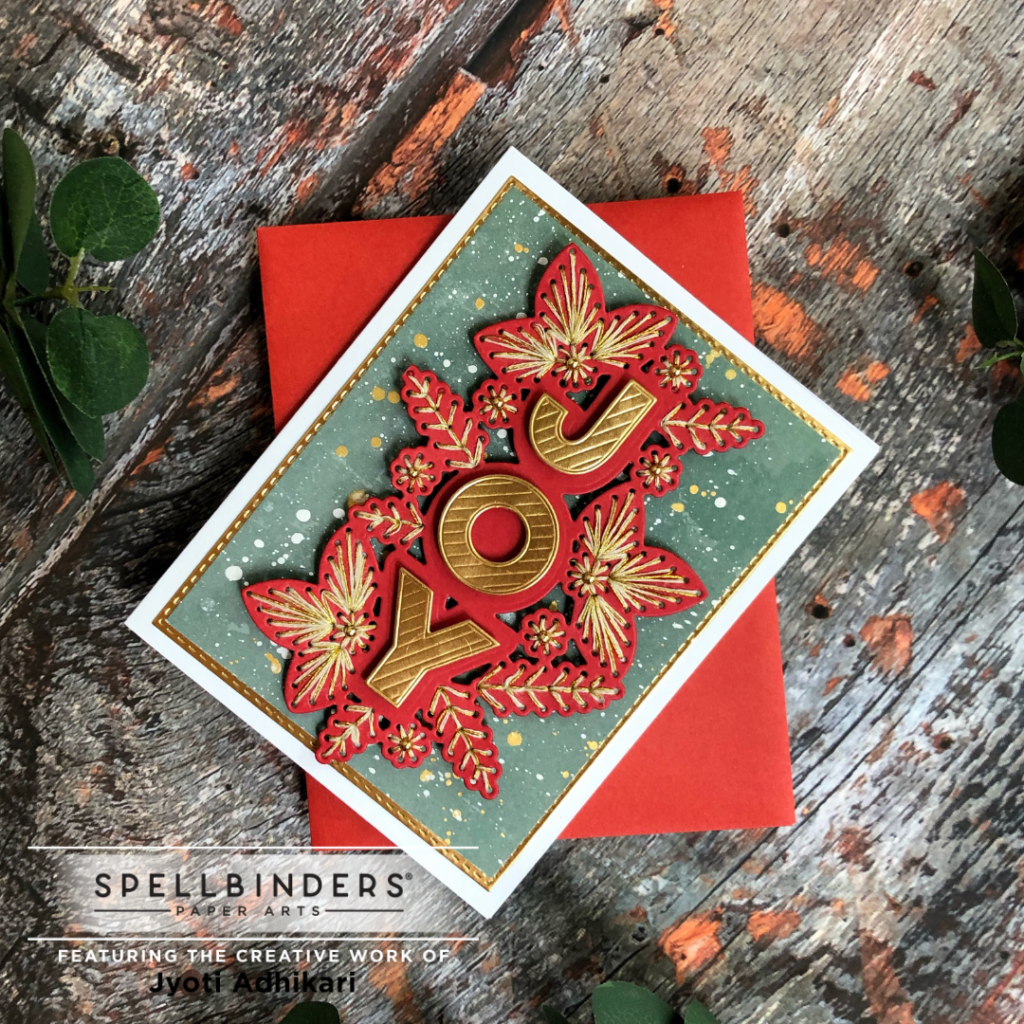 the angular view of the red stitched joy card i created with the die set from the Stitched Christmas collection from Spellbinders July 2022.