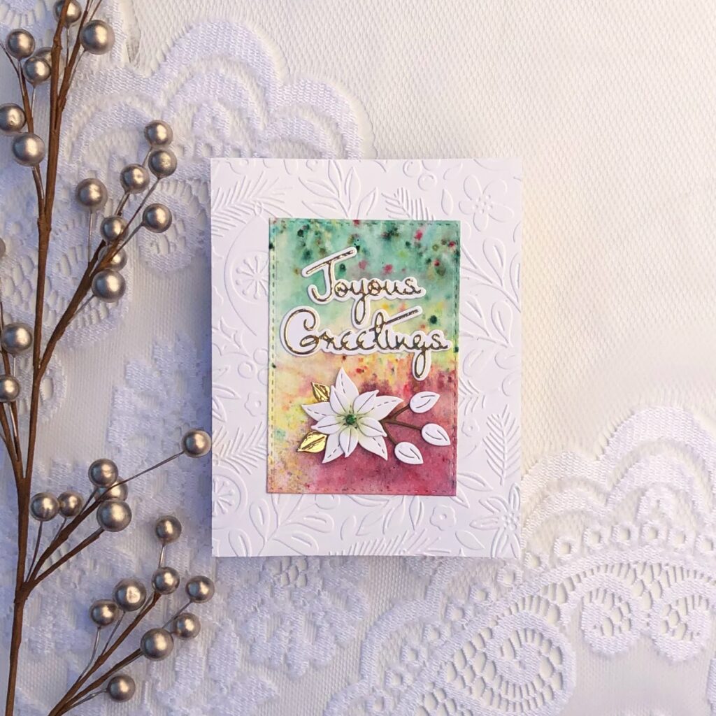 Joyous Greetings card created with the small die of the month for oct 22 by spellbinders. It is called Outlined Christmas Sentiments.